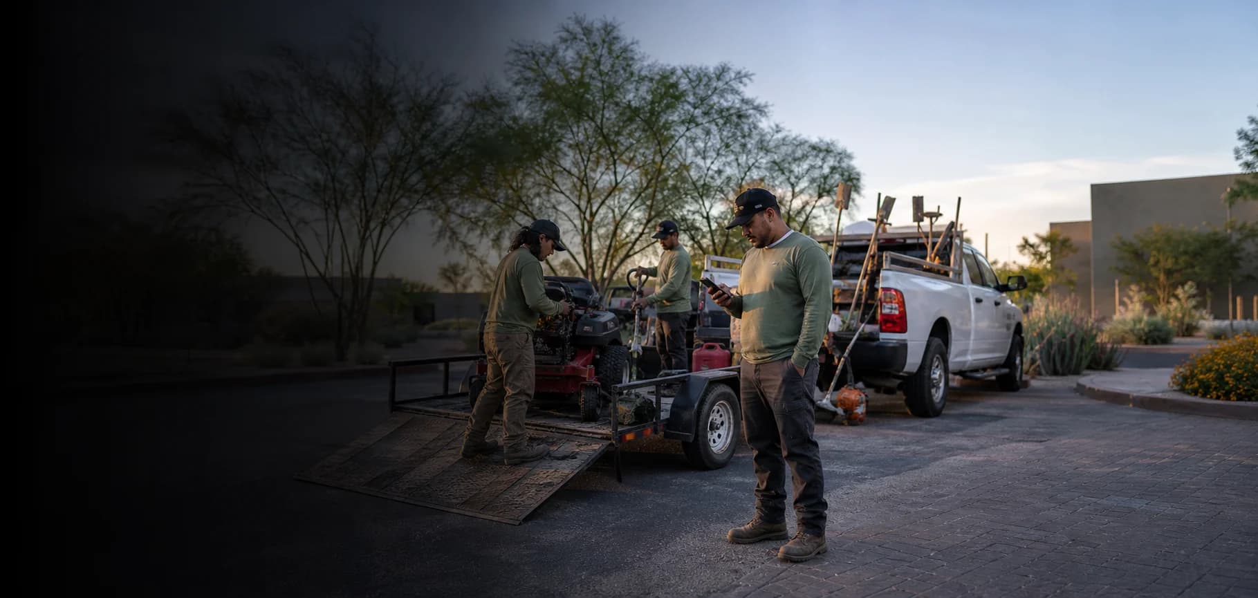A landscaping crew starting work at dawn